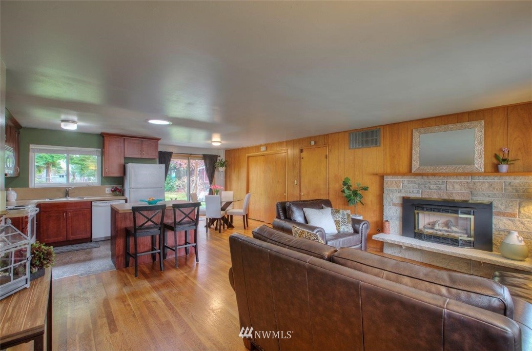 4209 Northeast 11th Street Renton, WA 98059 - Photo 6 of 17 a living room with furniture and a fireplace
