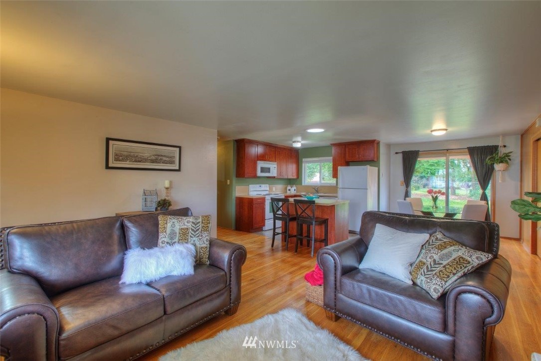 4209 Northeast 11th Street Renton, WA 98059 - Photo 7 of 17 a living room with furniture and a large window