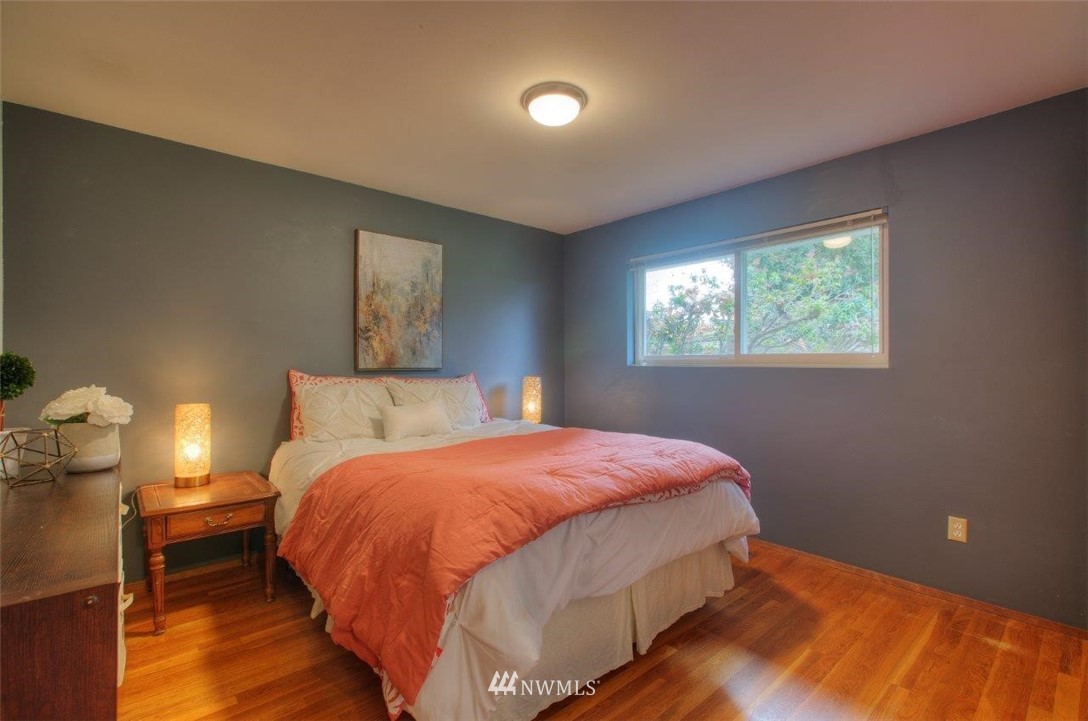4209 Northeast 11th Street Renton, WA 98059 - Photo 10 of 17 a bedroom with a bed and window