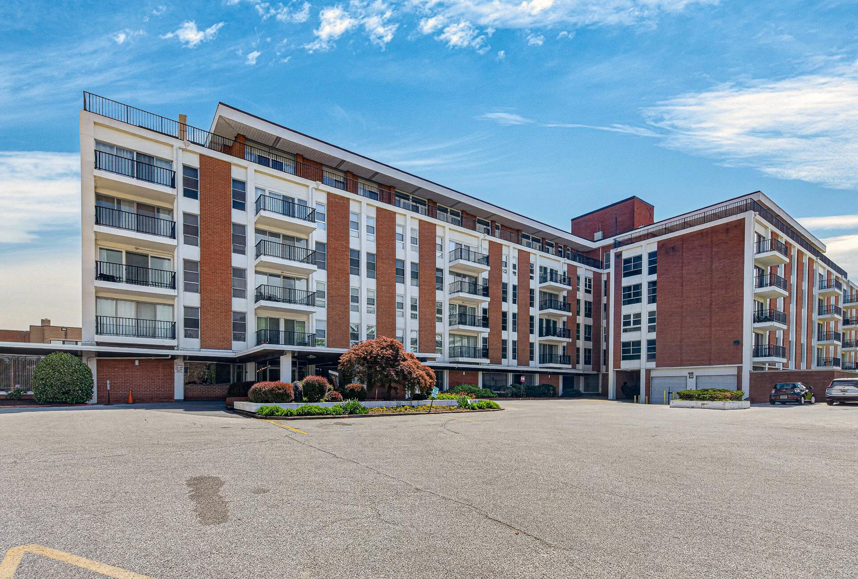 3601 Clarks Lane, Unit 418 Baltimore, MD 21215 - Photo 1 of 28 a front view of a building with a street