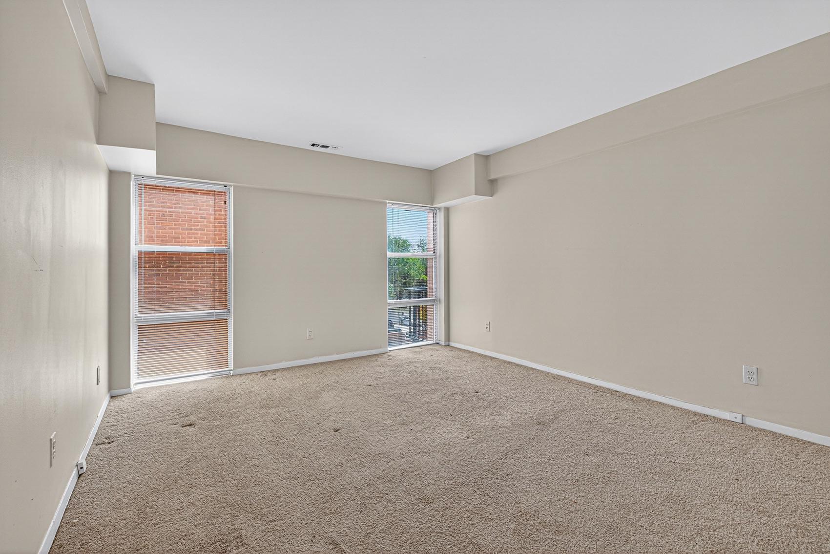 3601 Clarks Lane, Unit 418 Baltimore, MD 21215 - Photo 16 of 28 a view of an empty room with closet and a window
