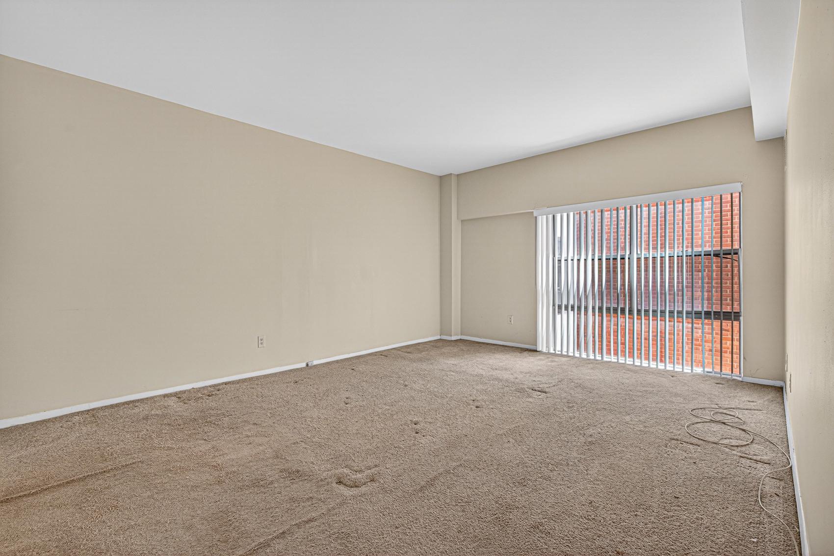 3601 Clarks Lane, Unit 418 Baltimore, MD 21215 - Photo 17 of 28 an empty room with windows