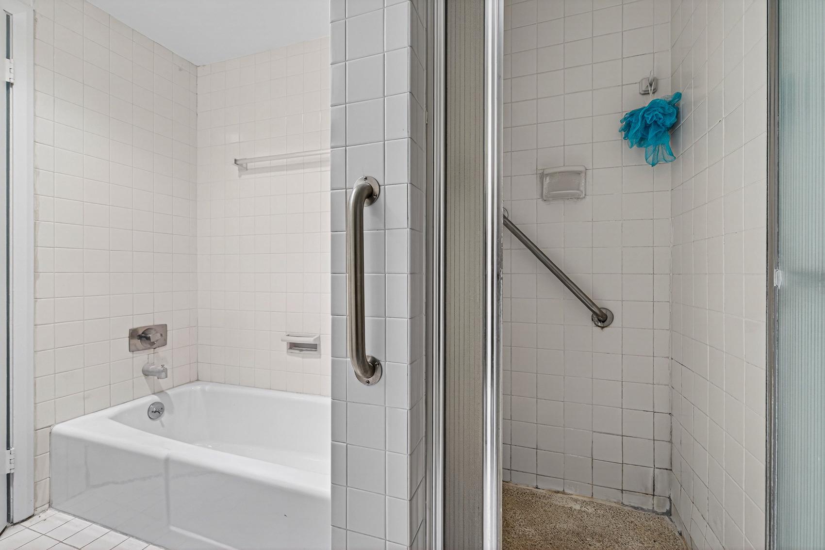 3601 Clarks Lane, Unit 418 Baltimore, MD 21215 - Photo 21 of 28 a bath room with a shower and a bath tub