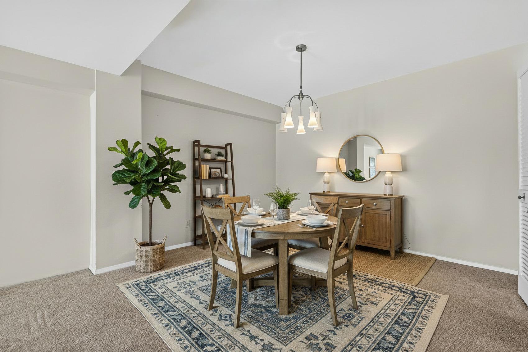 3601 Clarks Lane, Unit 418 Baltimore, MD 21215 - Photo 4 of 28 a view of a dining room with furniture