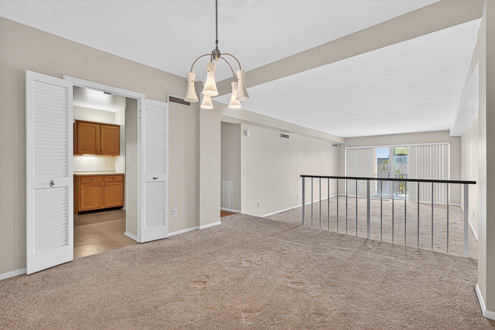 3601 Clarks Lane, Unit 418 Baltimore, MD 21215 - Photo 9 of 28 a view of a livingroom with a ceiling fan and window