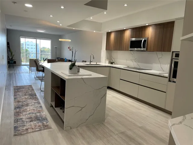 a kitchen with a stove and a sink