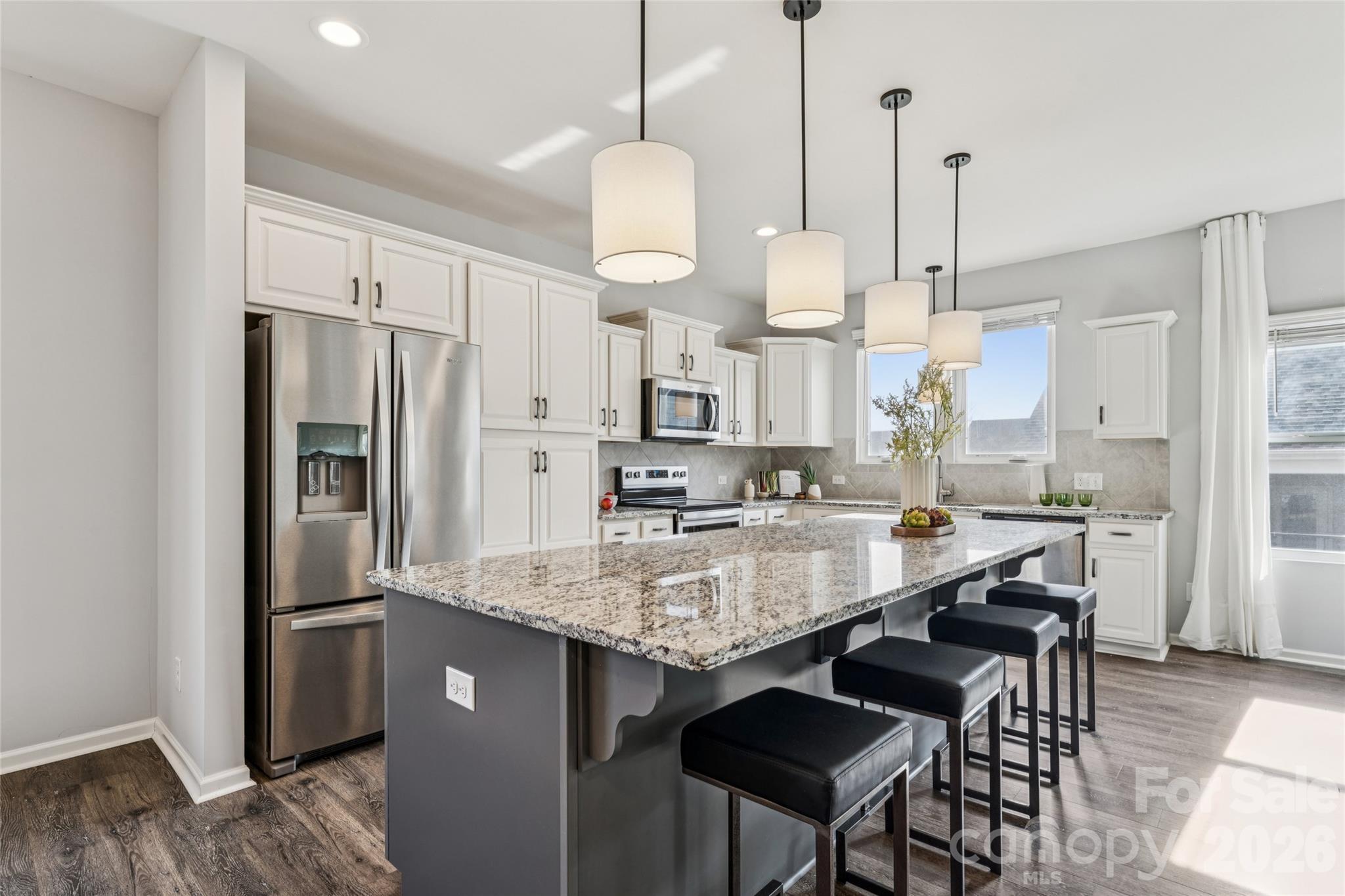 50139 Robins Nest Lane Lancaster, SC 29720 - Photo 1 of 30 a large kitchen with granite countertop a counter space stainless steel appliances and a chandelier