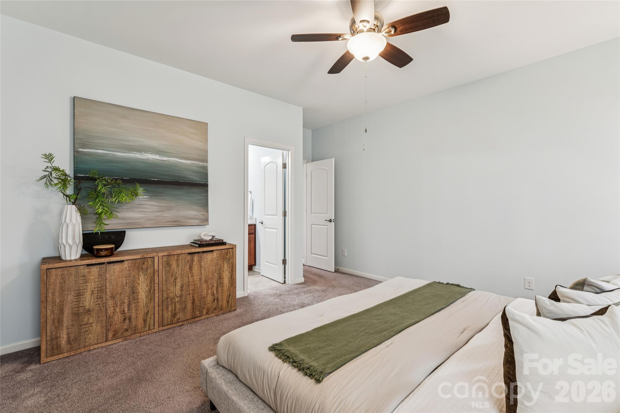 50139 Robins Nest Lane Lancaster, SC 29720 - Photo 12 of 30 a bedroom with a bed and a chandelier