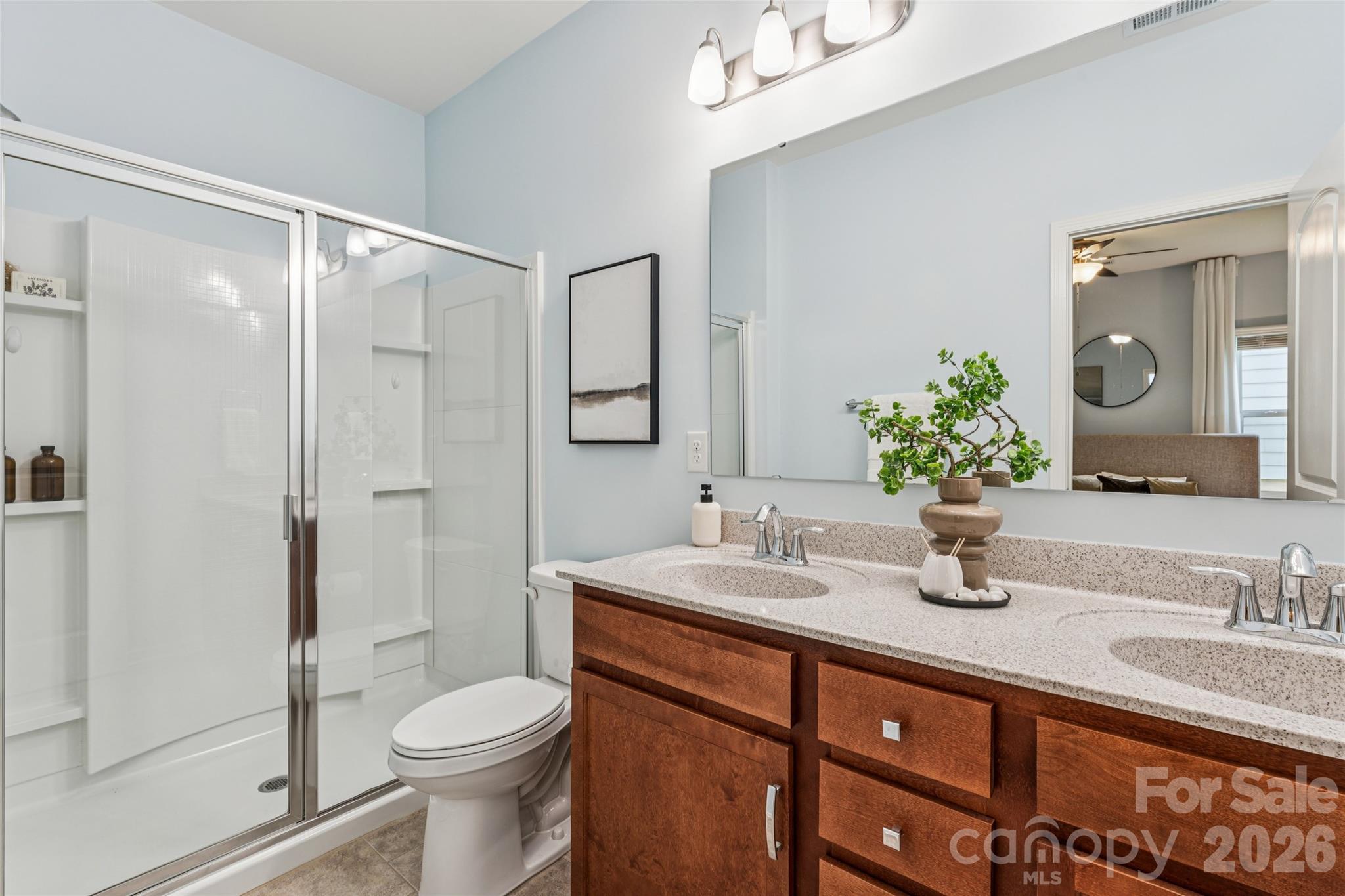 50139 Robins Nest Lane Lancaster, SC 29720 - Photo 14 of 30 a bathroom with a granite countertop sink toilet and shower