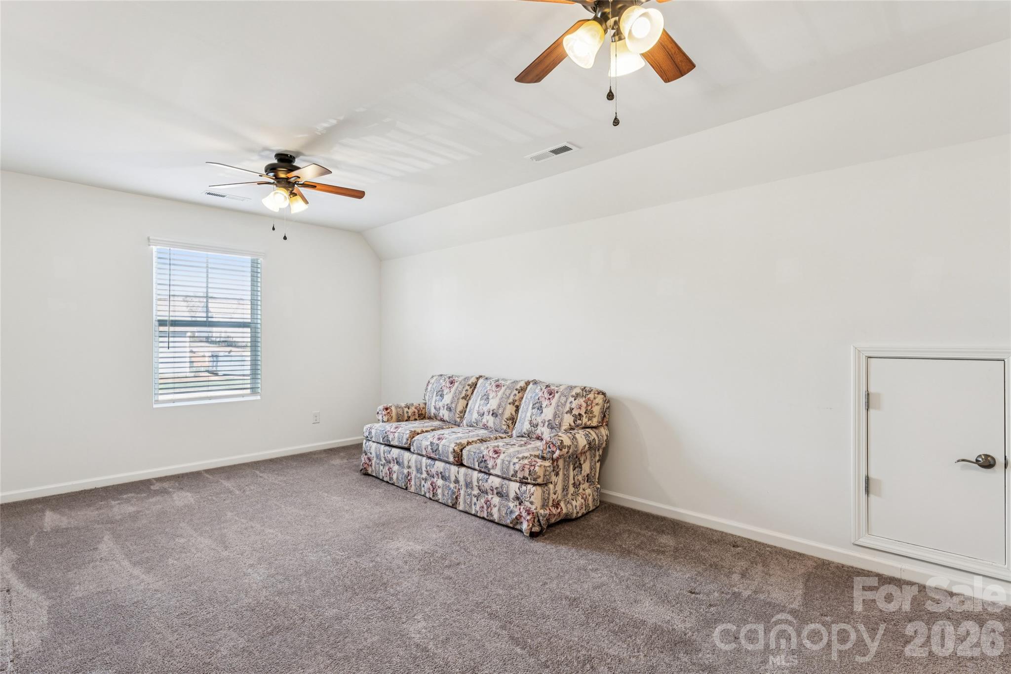 50139 Robins Nest Lane Lancaster, SC 29720 - Photo 19 of 30 an empty room with windows and chandelier fan