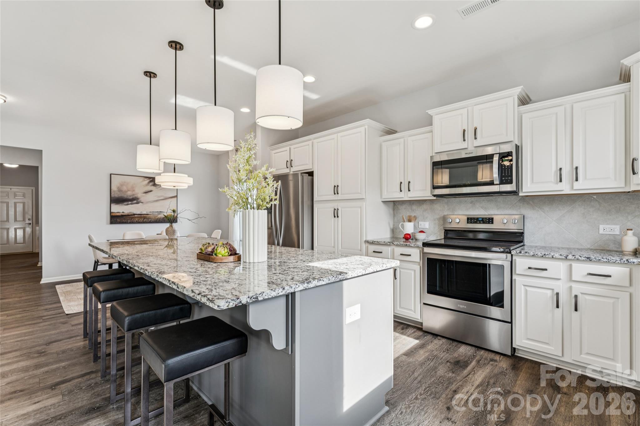 50139 Robins Nest Lane Lancaster, SC 29720 - Photo 2 of 30 a kitchen with stainless steel appliances kitchen island granite countertop a stove a sink and a refrigerator