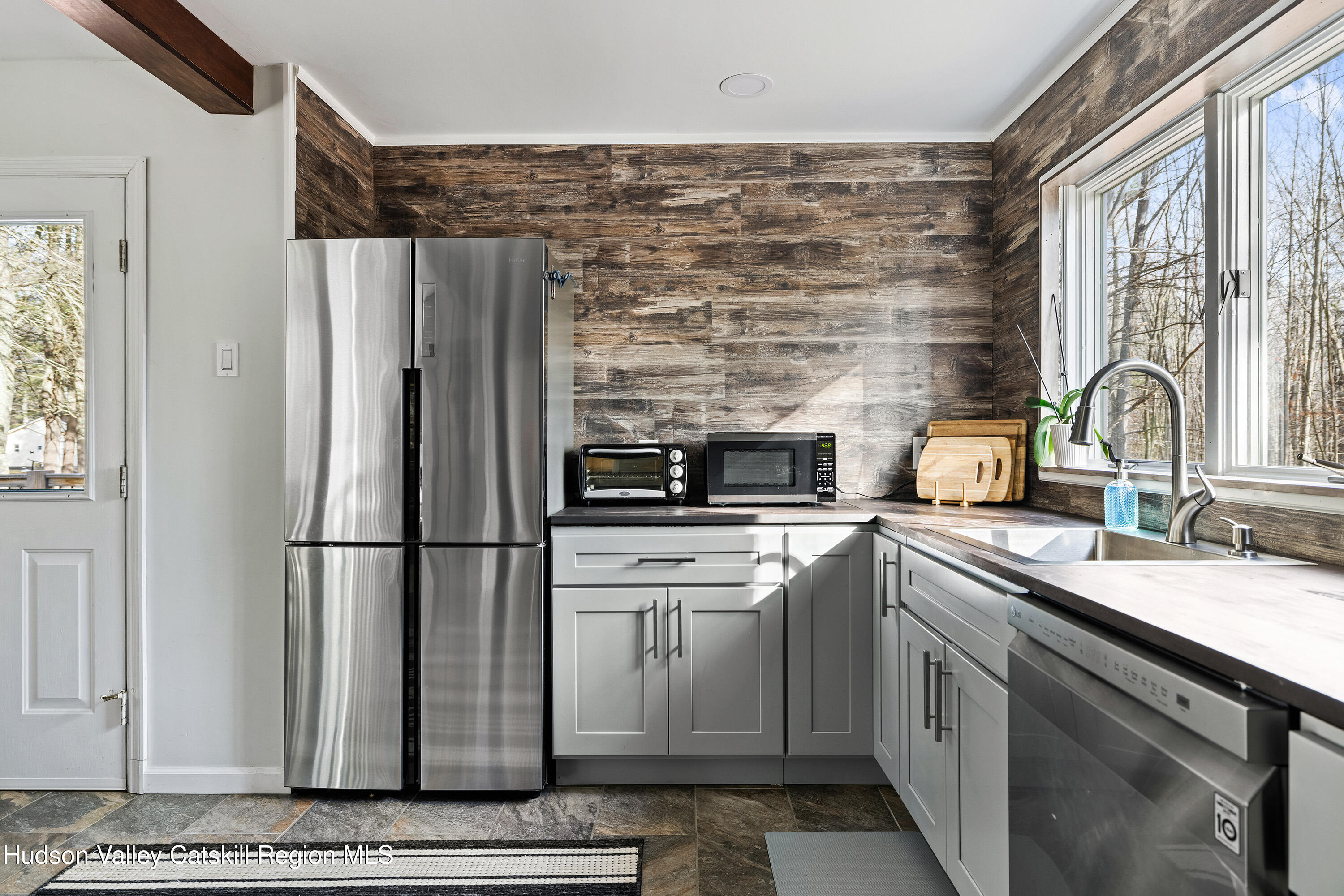 150 Vining Road Windham, NY 12496 - Photo 11 of 49 a kitchen with appliances a sink and cabinets