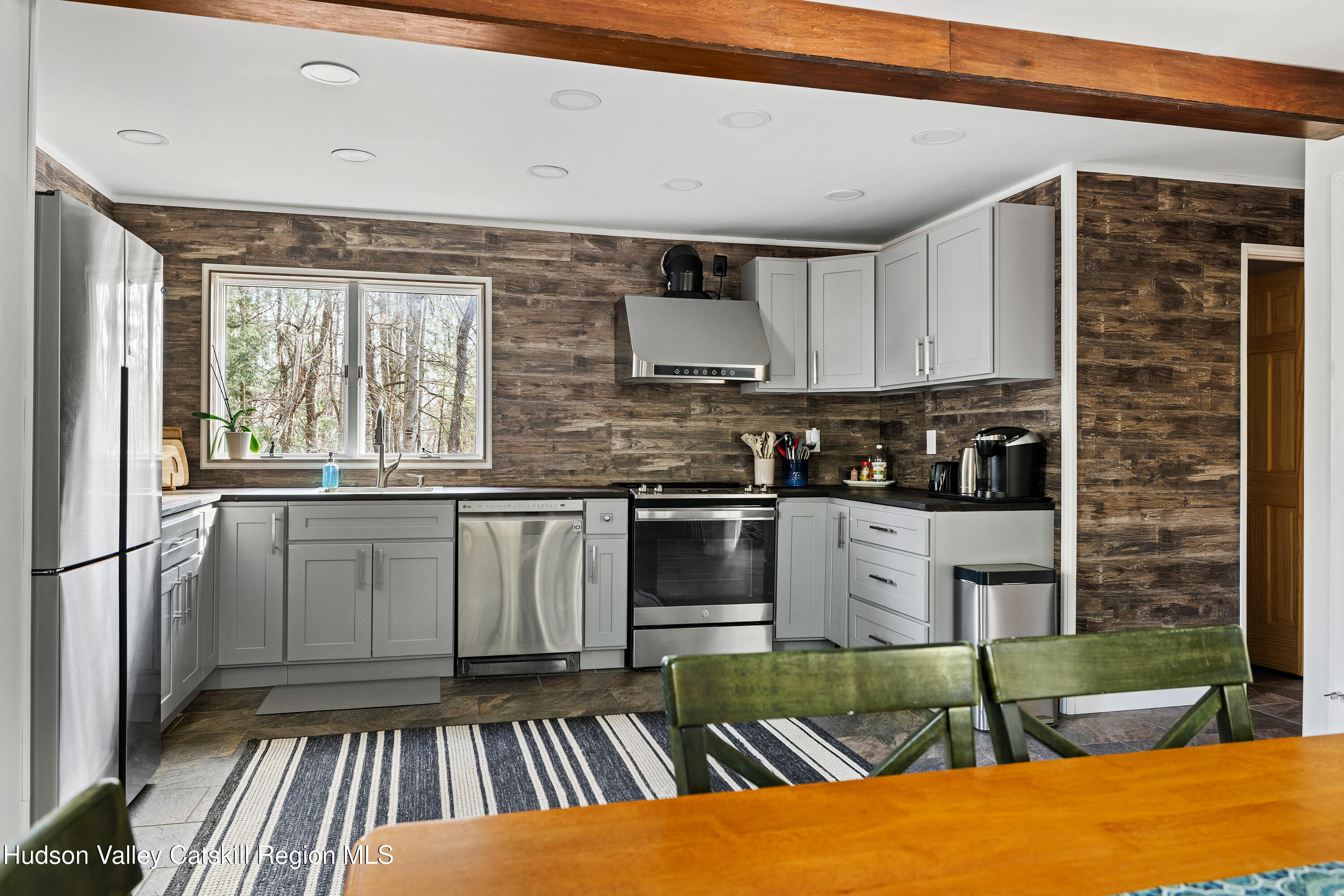 150 Vining Road Windham, NY 12496 - Photo 12 of 49 a kitchen with stainless steel appliances granite countertop a stove a sink and a refrigerator