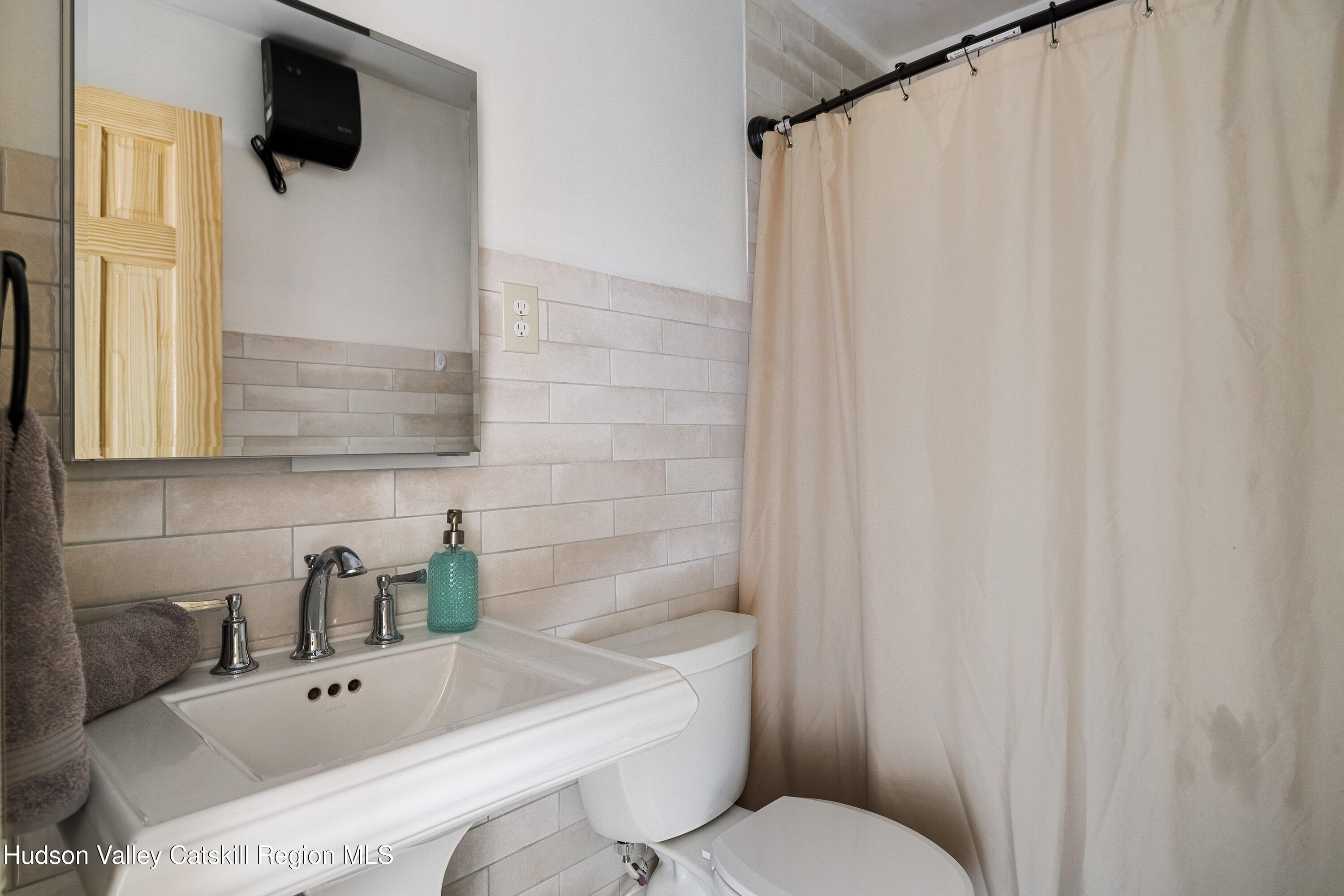 150 Vining Road Windham, NY 12496 - Photo 18 of 49 a bathroom with a toilet and a sink