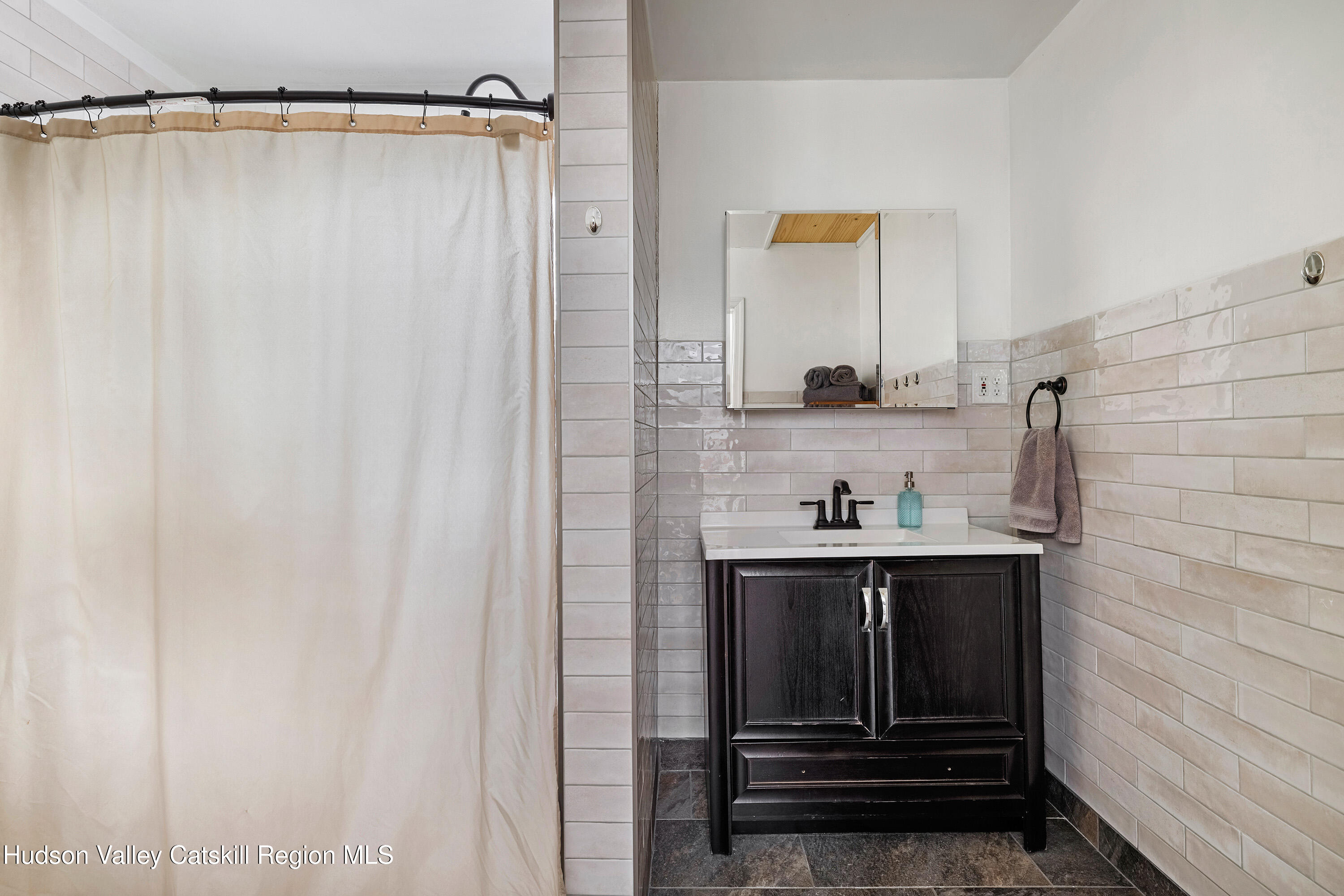 150 Vining Road Windham, NY 12496 - Photo 27 of 49 a bathroom with a sink and a mirror