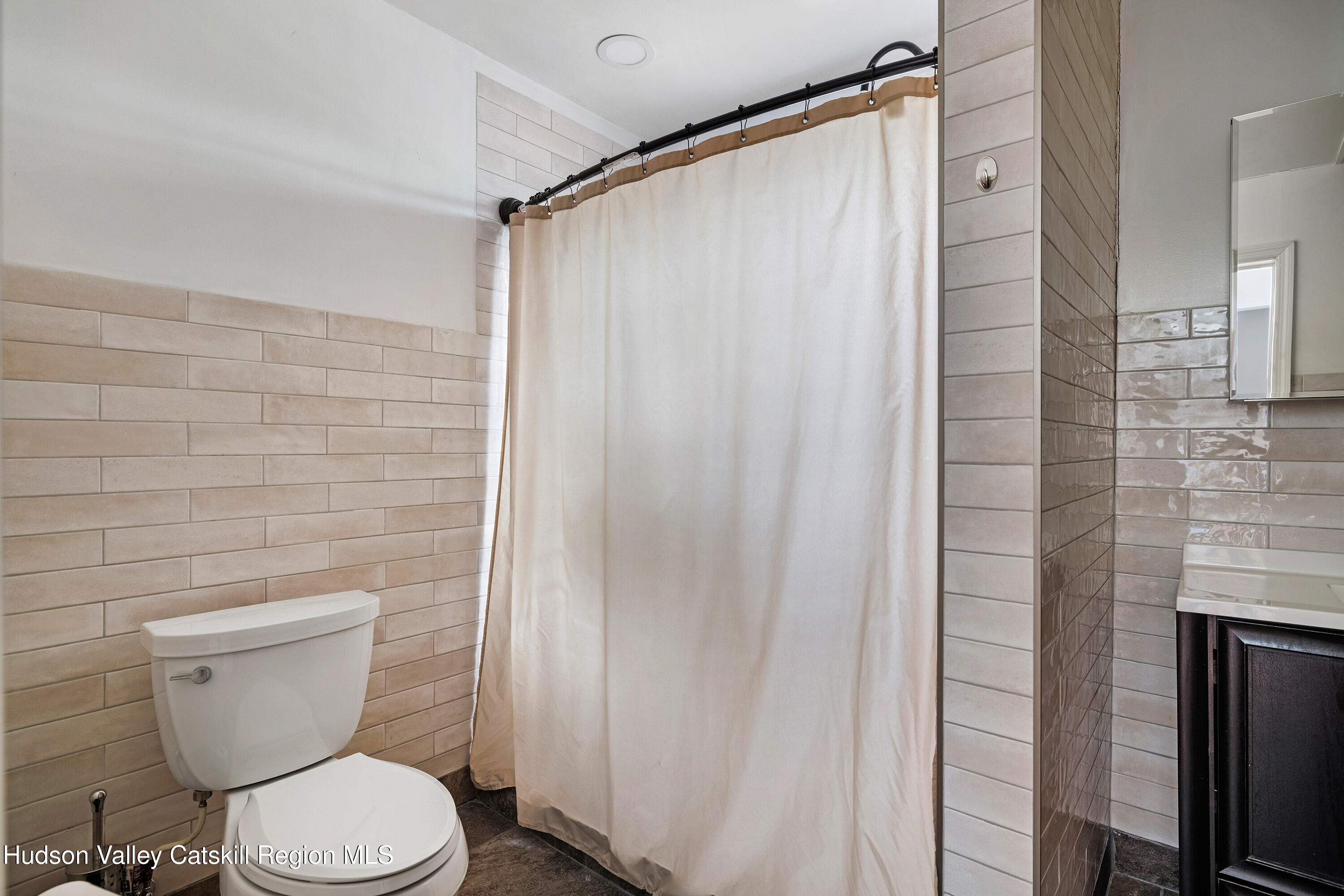 150 Vining Road Windham, NY 12496 - Photo 28 of 49 a white toilet sitting next to a shower curtain