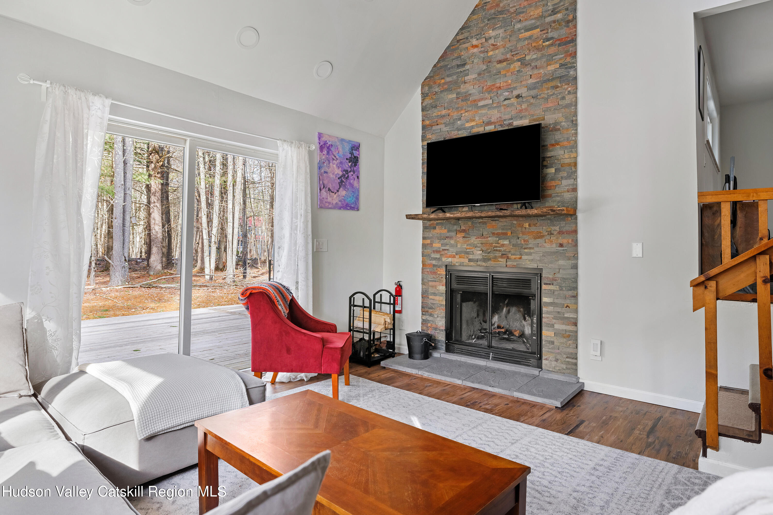 150 Vining Road Windham, NY 12496 - Photo 4 of 49 a living room with furniture a flat screen tv and a fireplace