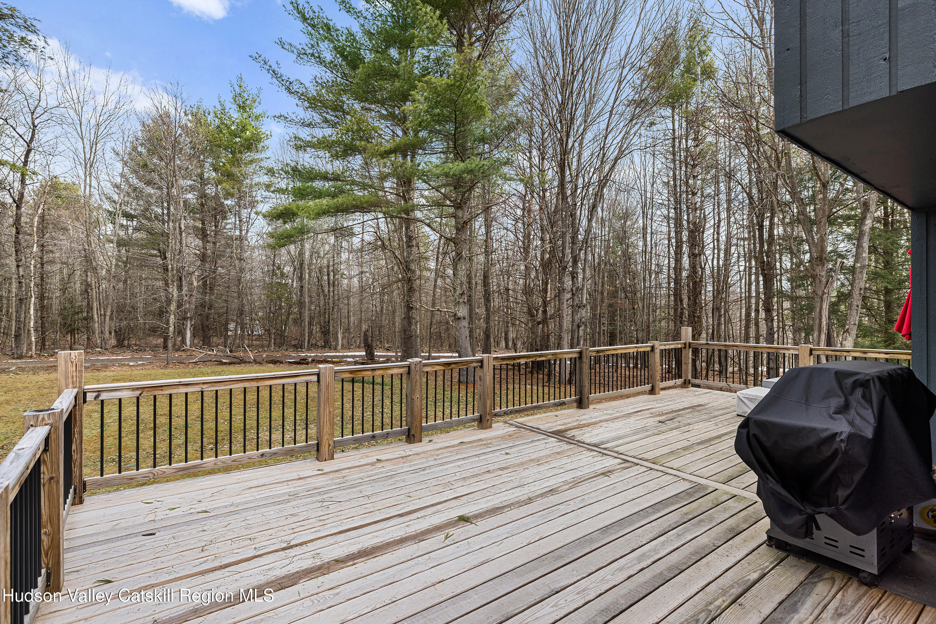 150 Vining Road Windham, NY 12496 - Photo 44 of 49 a view of a roof deck with two couches and wooden floor