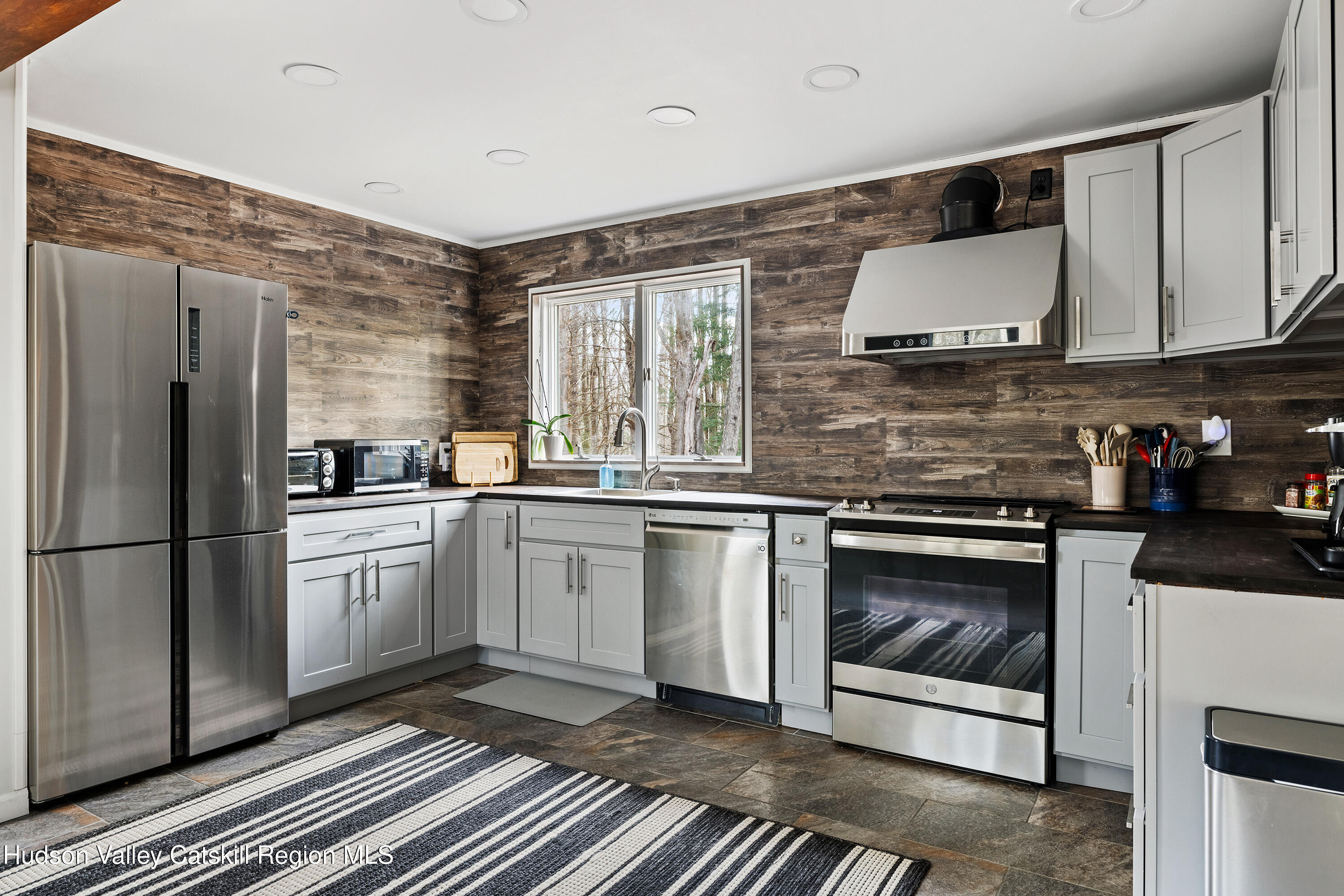 150 Vining Road Windham, NY 12496 - Photo 8 of 49 a kitchen with a sink stove and refrigerator