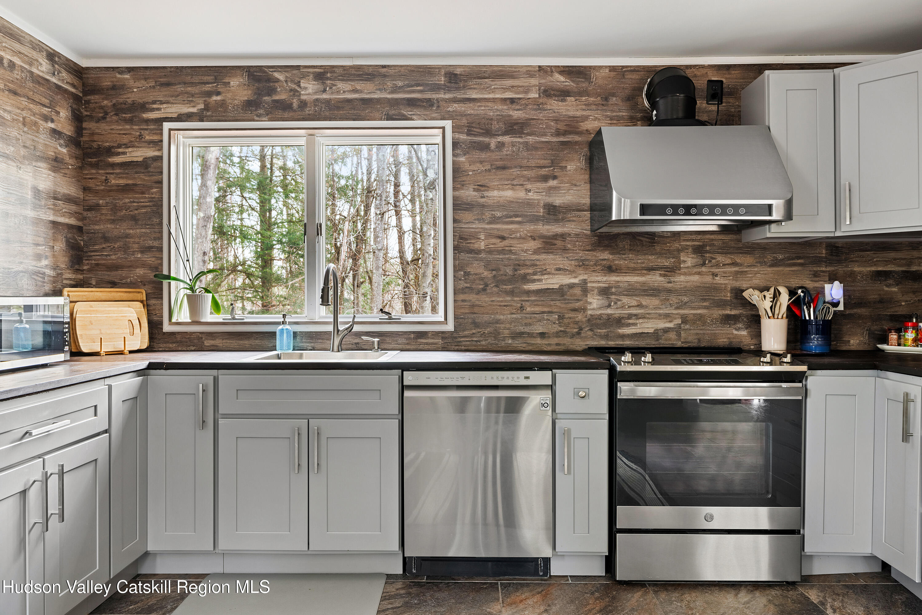 150 Vining Road Windham, NY 12496 - Photo 9 of 49 a kitchen with granite countertop a sink and a stove