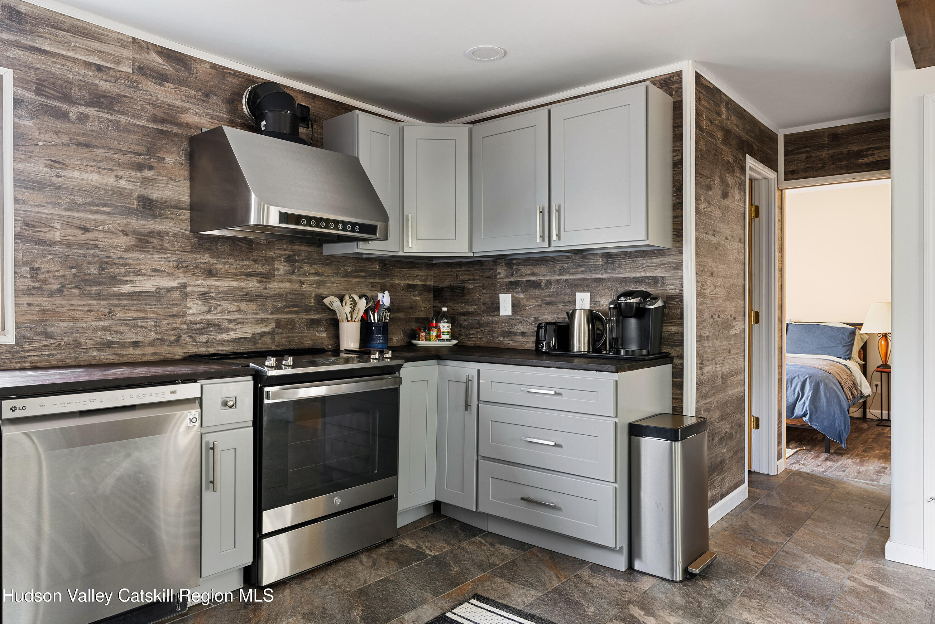 150 Vining Road Windham, NY 12496 - Photo 10 of 49 a kitchen with stainless steel appliances granite countertop a stove a sink and a refrigerator