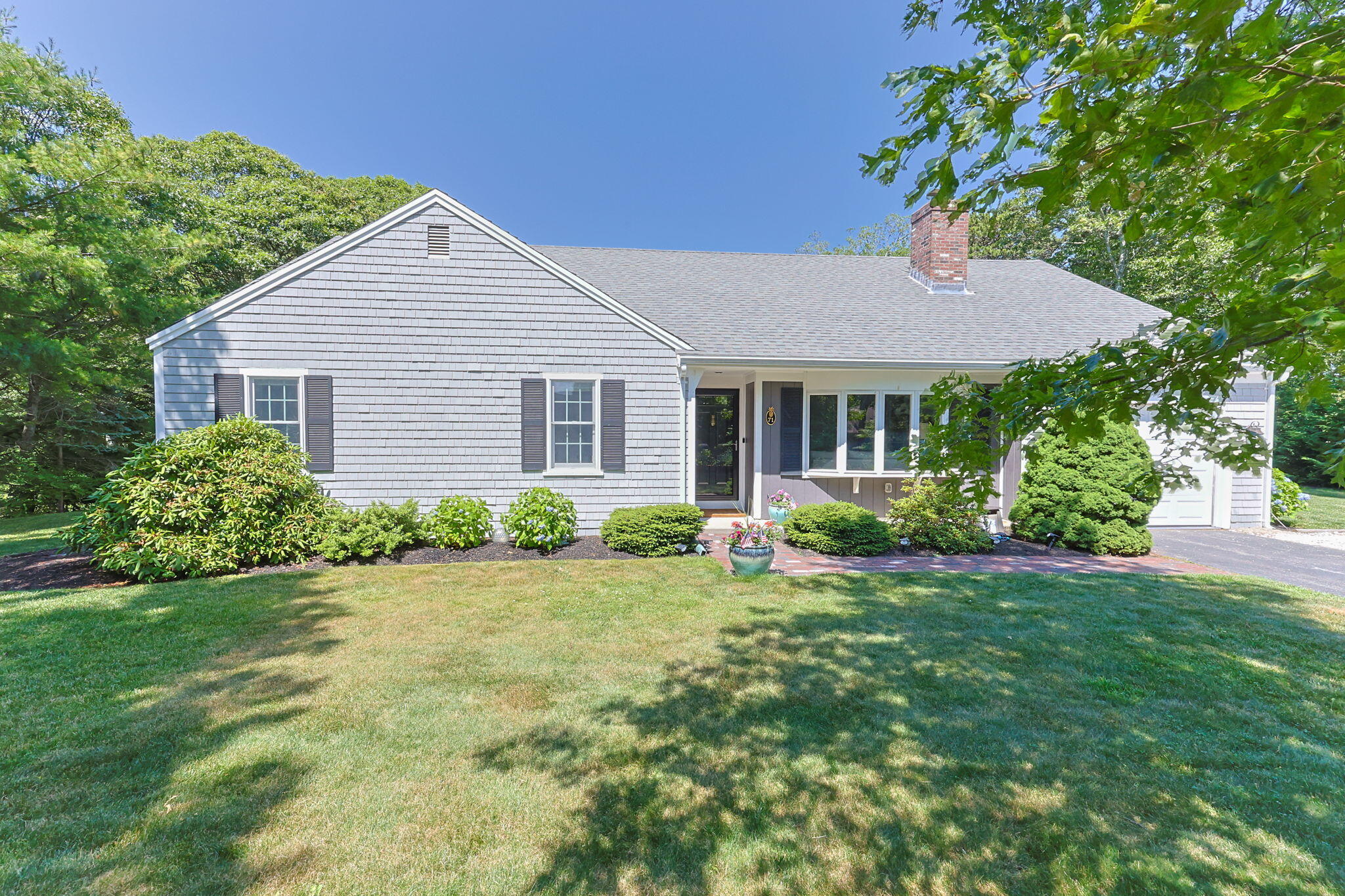 71 Potonumecot Road Chatham, MA 02633 - Photo 2 of 46 a house view with a garden space