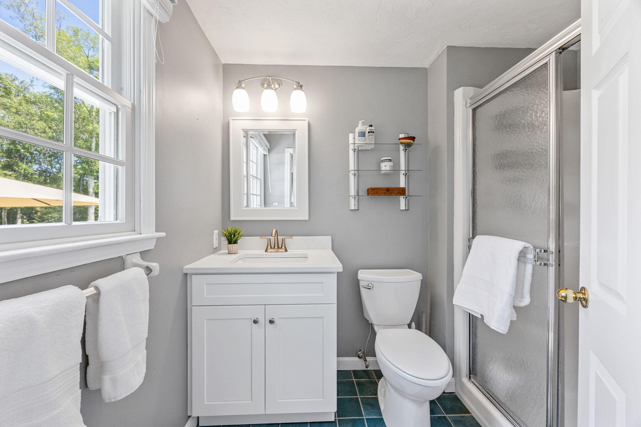 71 Potonumecot Road Chatham, MA 02633 - Photo 27 of 46 a bathroom with a toilet sink and mirror