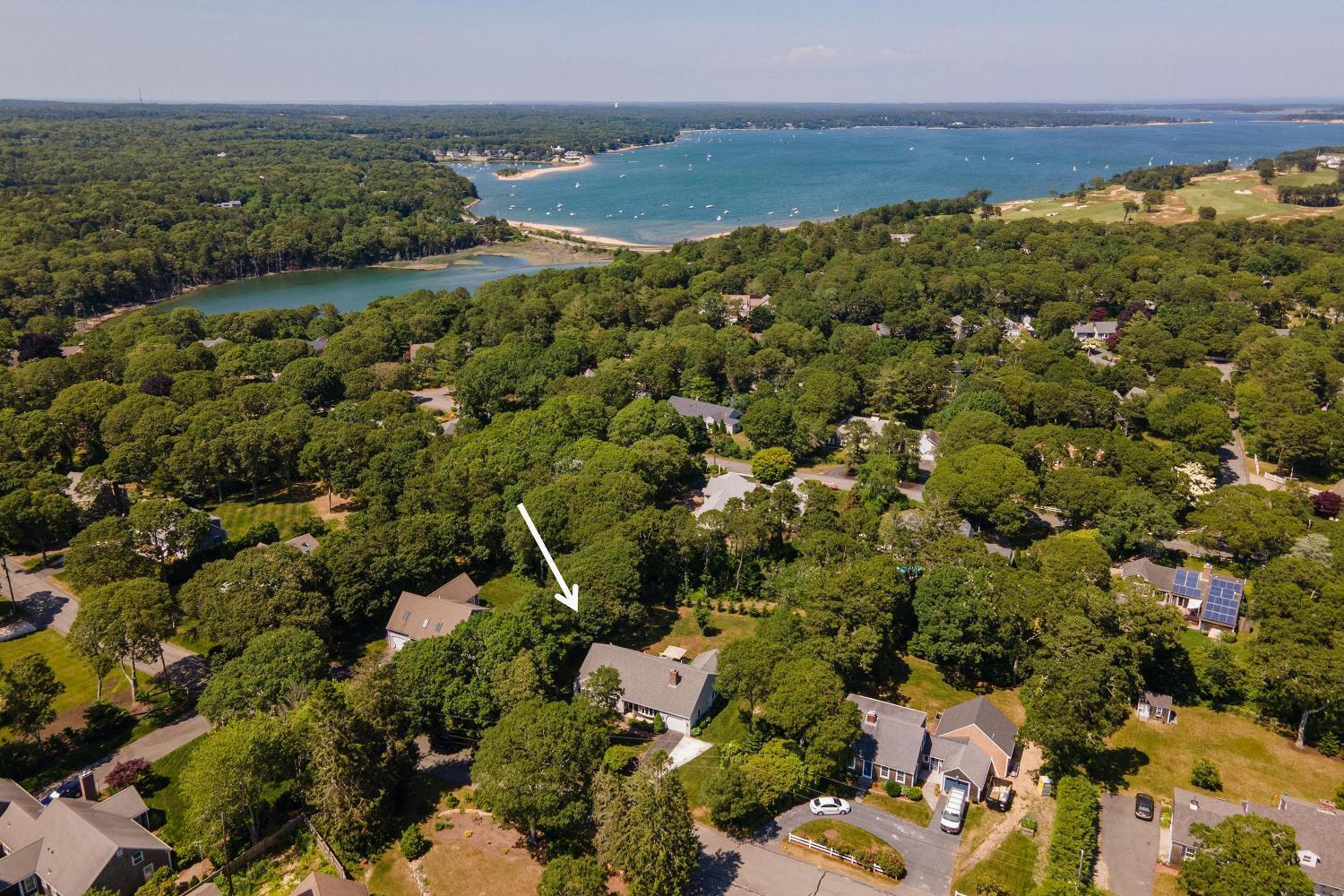 71 Potonumecot Road Chatham, MA 02633 - Photo 43 of 46 an aerial view of a houses with a lake