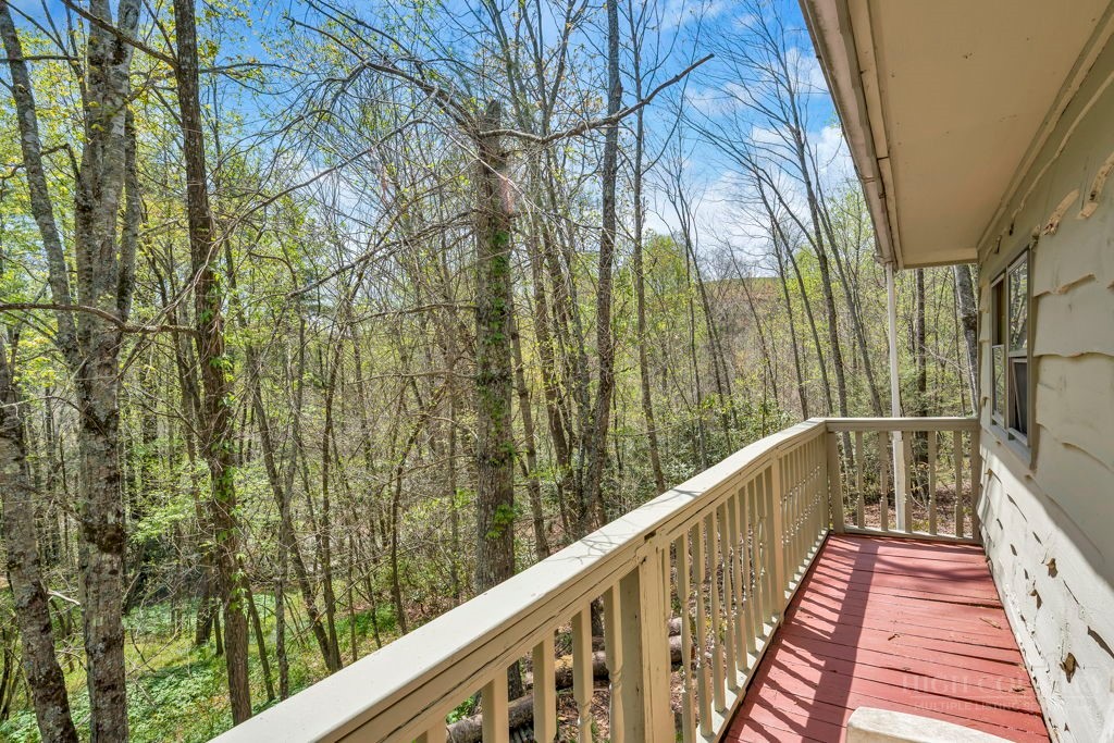 179 Soave Ridge Deep Gap, NC 28618 - Photo 8 of 31 a view of balcony with wooden floor and fence