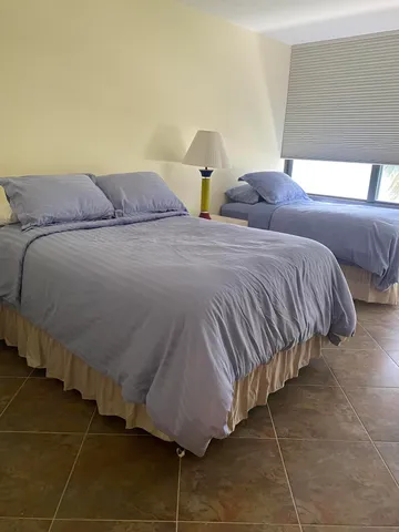 a large kitchen with a table and chairs in it