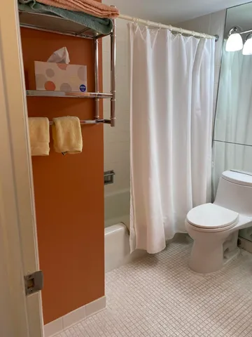 a view of balcony with two chairs and wooden floor