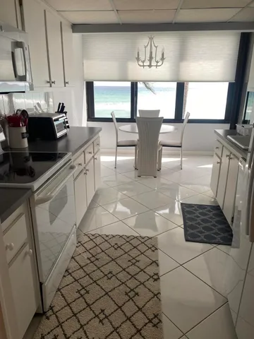 a view of a door and chair in the room