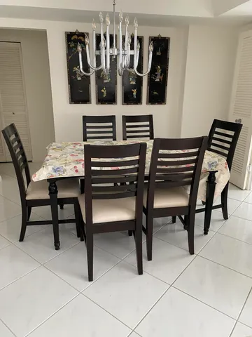 a white toilet sitting next to a shower