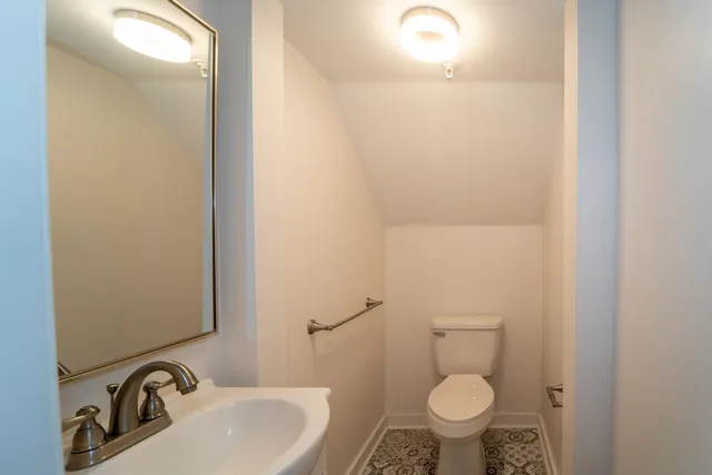 a bathroom with a granite countertop window and a shower