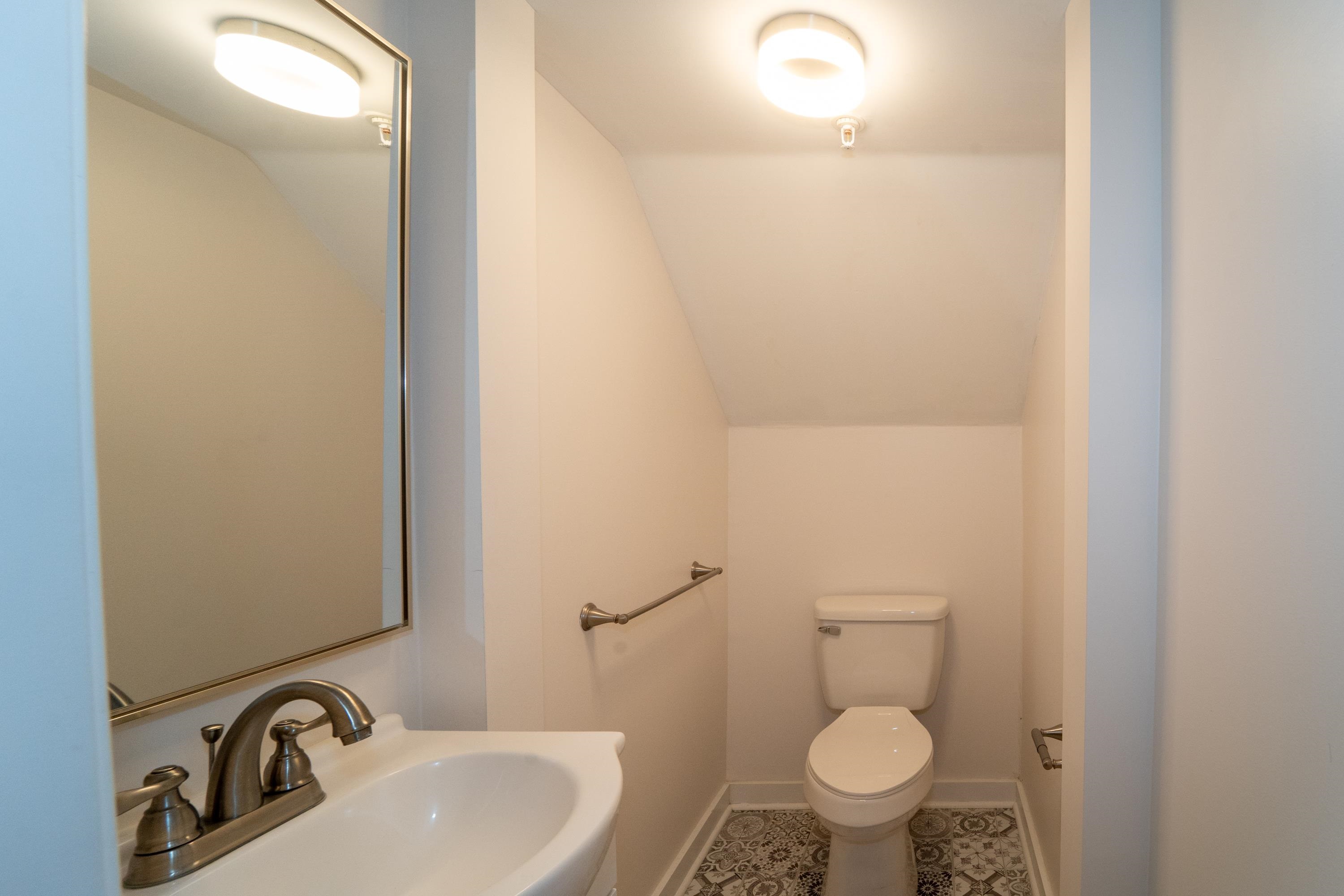 11 Aviles Street, Unit 3B St. Augustine, FL 32084 - Photo 15 of 17 a bathroom with a sink and a toilet