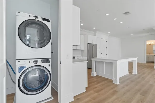 a view of a kitchen with a washer and dryer