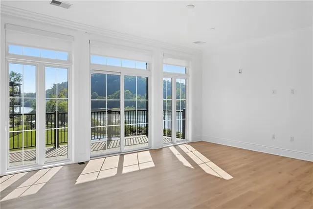 a view of an empty room with a balcony