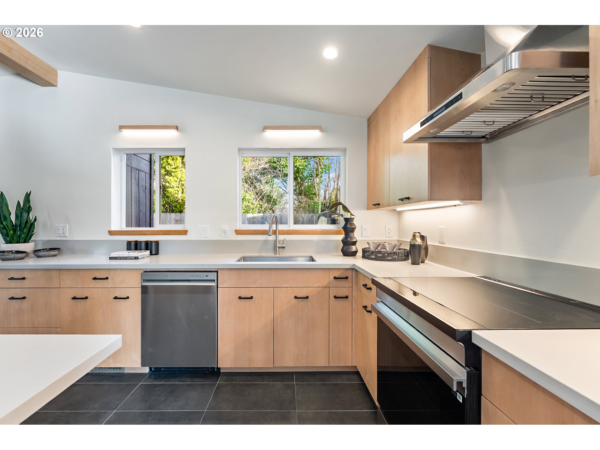 2437 Northeast 134th Place Portland, OR 97230 - Photo 14 of 40 a kitchen with a sink stove and cabinets