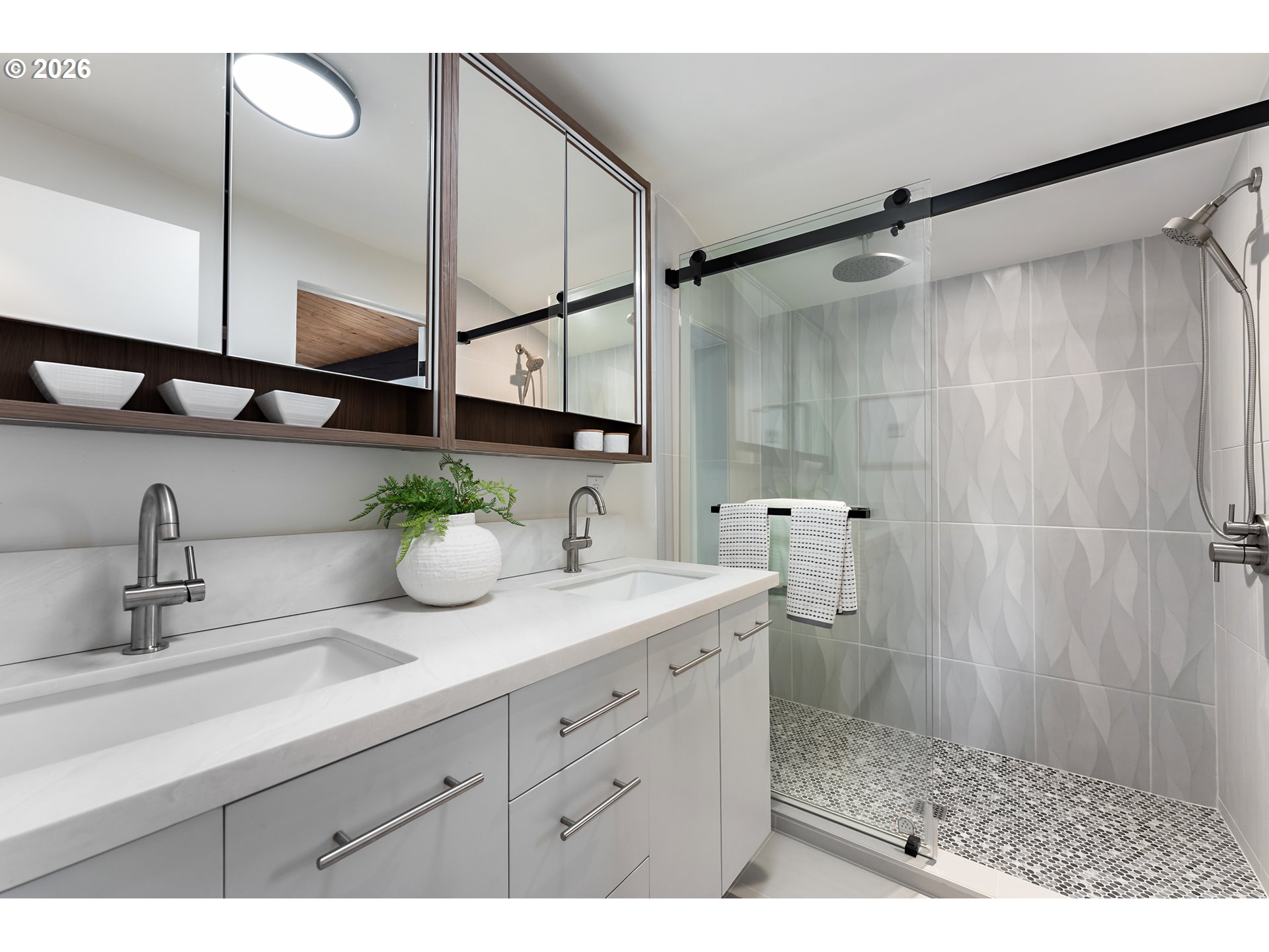 2437 Northeast 134th Place Portland, OR 97230 - Photo 22 of 40 a bathroom with a double vanity sink and mirror