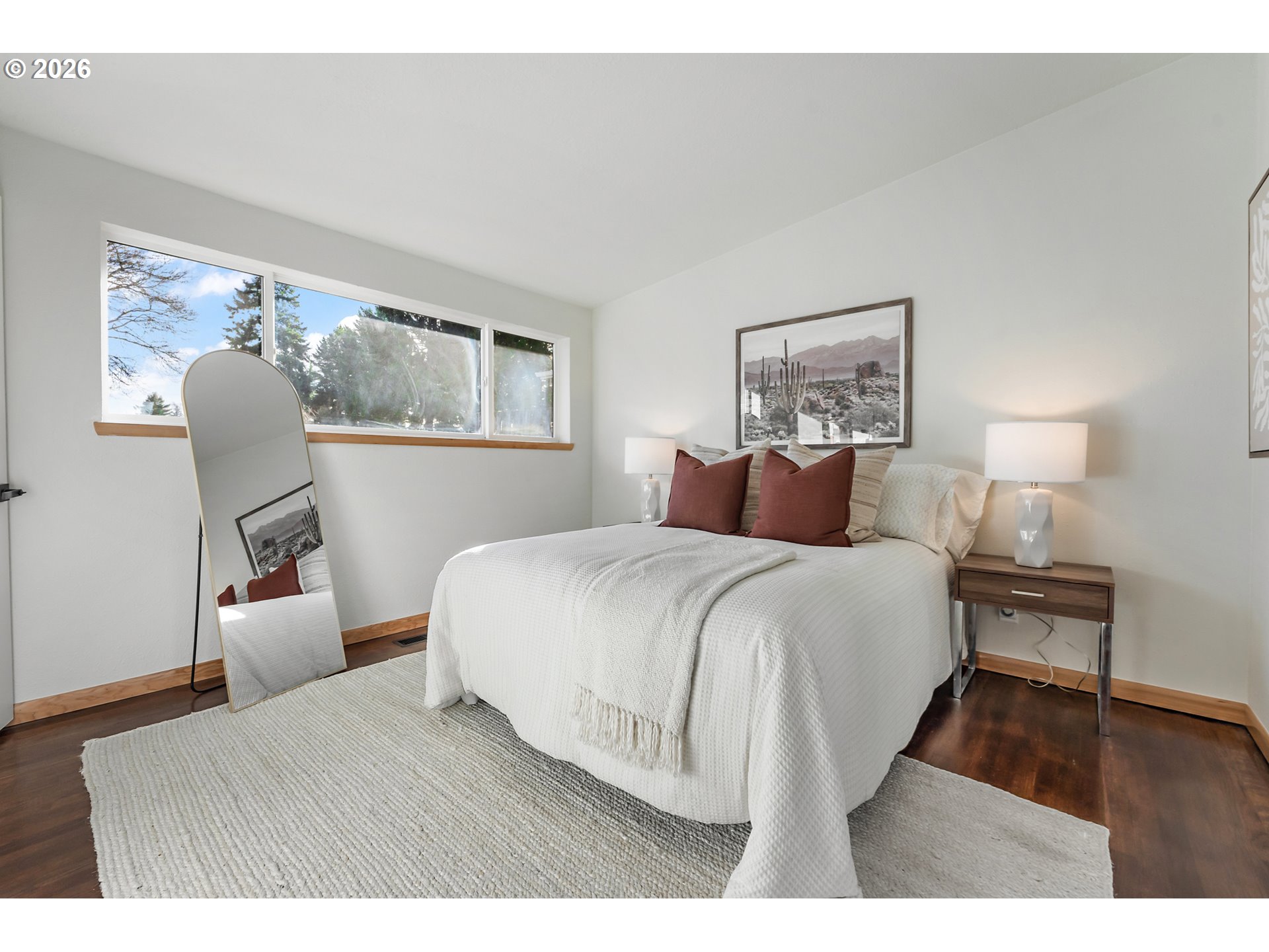 2437 Northeast 134th Place Portland, OR 97230 - Photo 24 of 40 a bedroom with a bed and wooden floor
