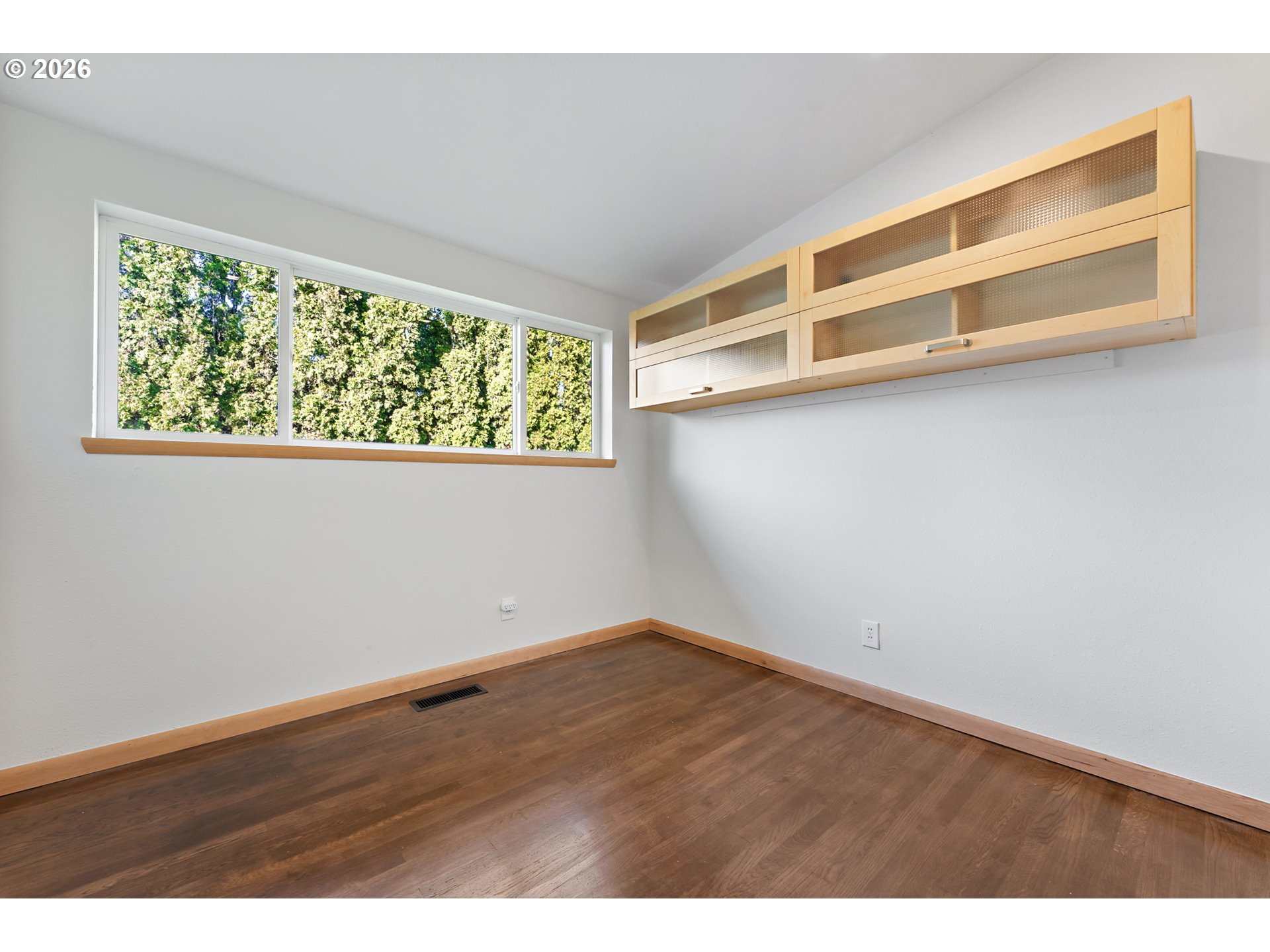 2437 Northeast 134th Place Portland, OR 97230 - Photo 28 of 40 a view of a room with wooden floor and windows
