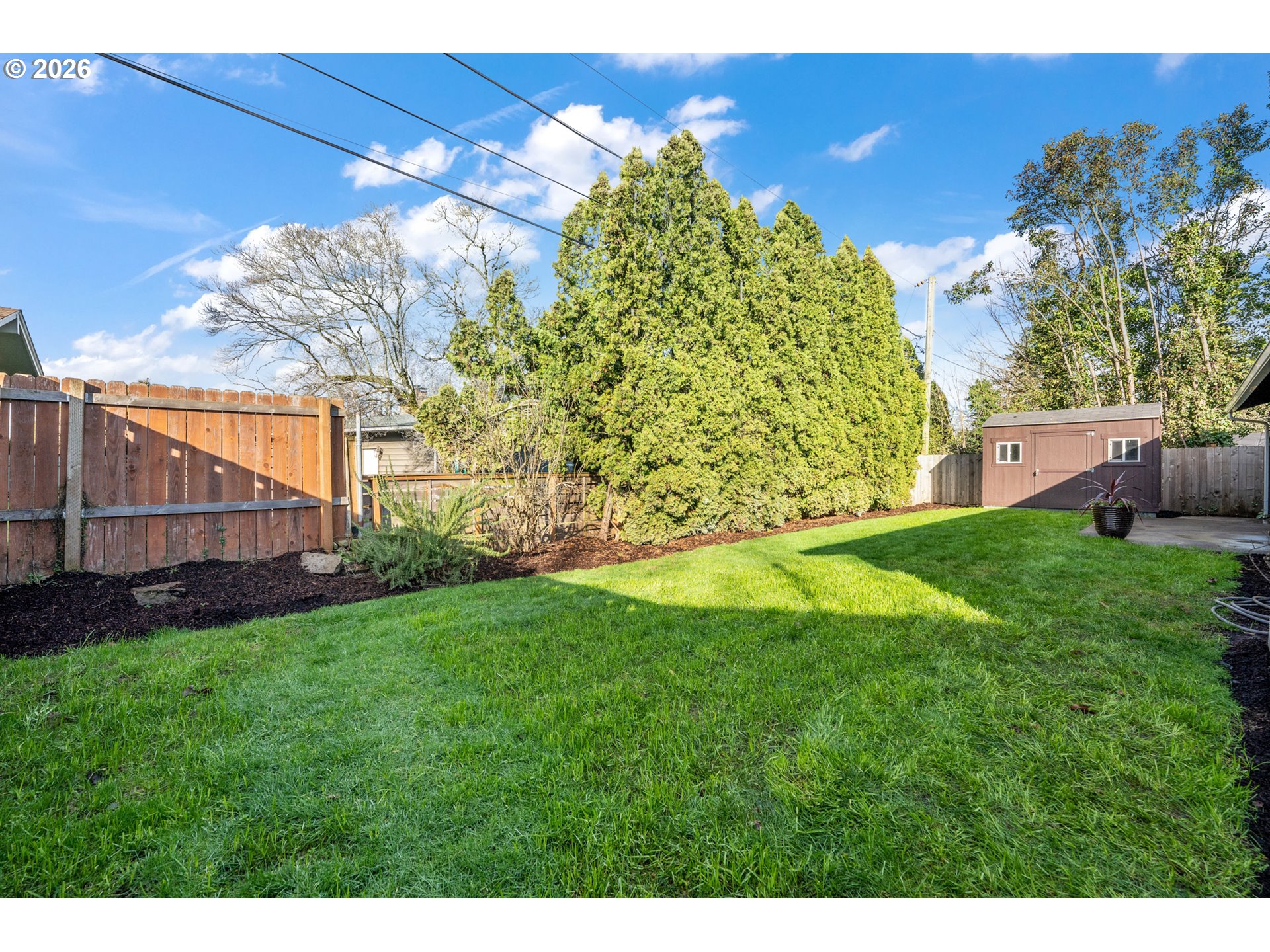 2437 Northeast 134th Place Portland, OR 97230 - Photo 32 of 40 a view of a backyard with a garden