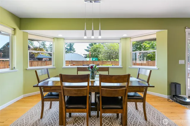 a view of a dining room with furniture window and outside view