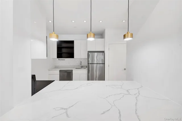 a kitchen with a sink and a oven