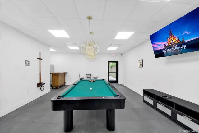 a room with furniture and pool table