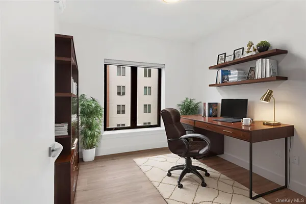 a view of a workspace with furniture