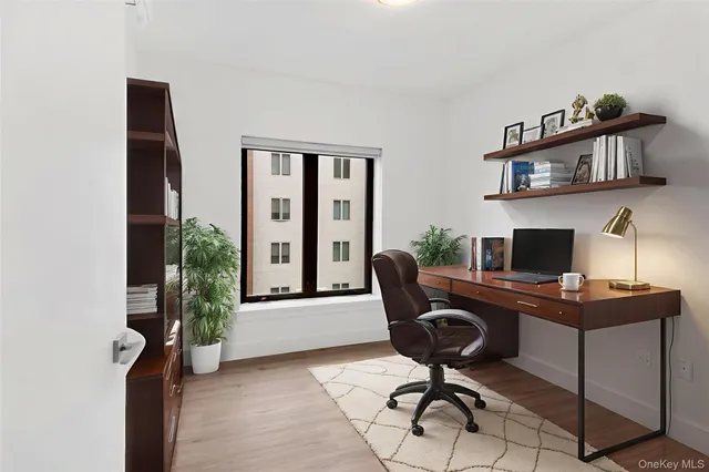 a view of a workspace with furniture