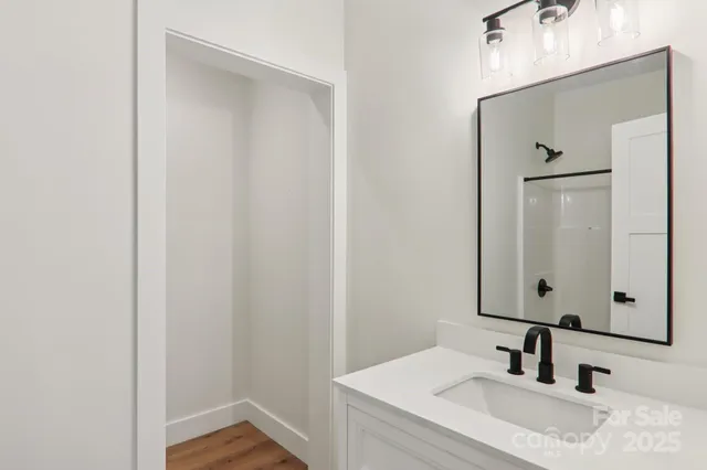 a bathroom with a shower and a bath tub
