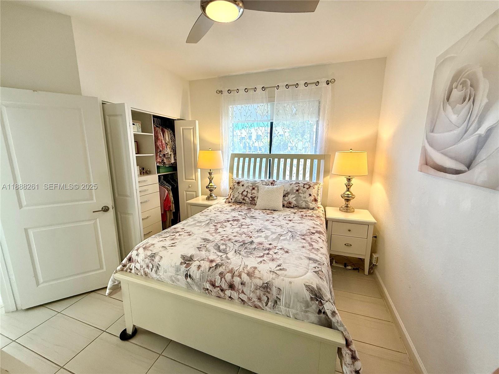 400 Northeast 208th Terrace, Unit 400 Miami, FL 33179 - Photo 13 of 53 a bedroom with a bed and a window