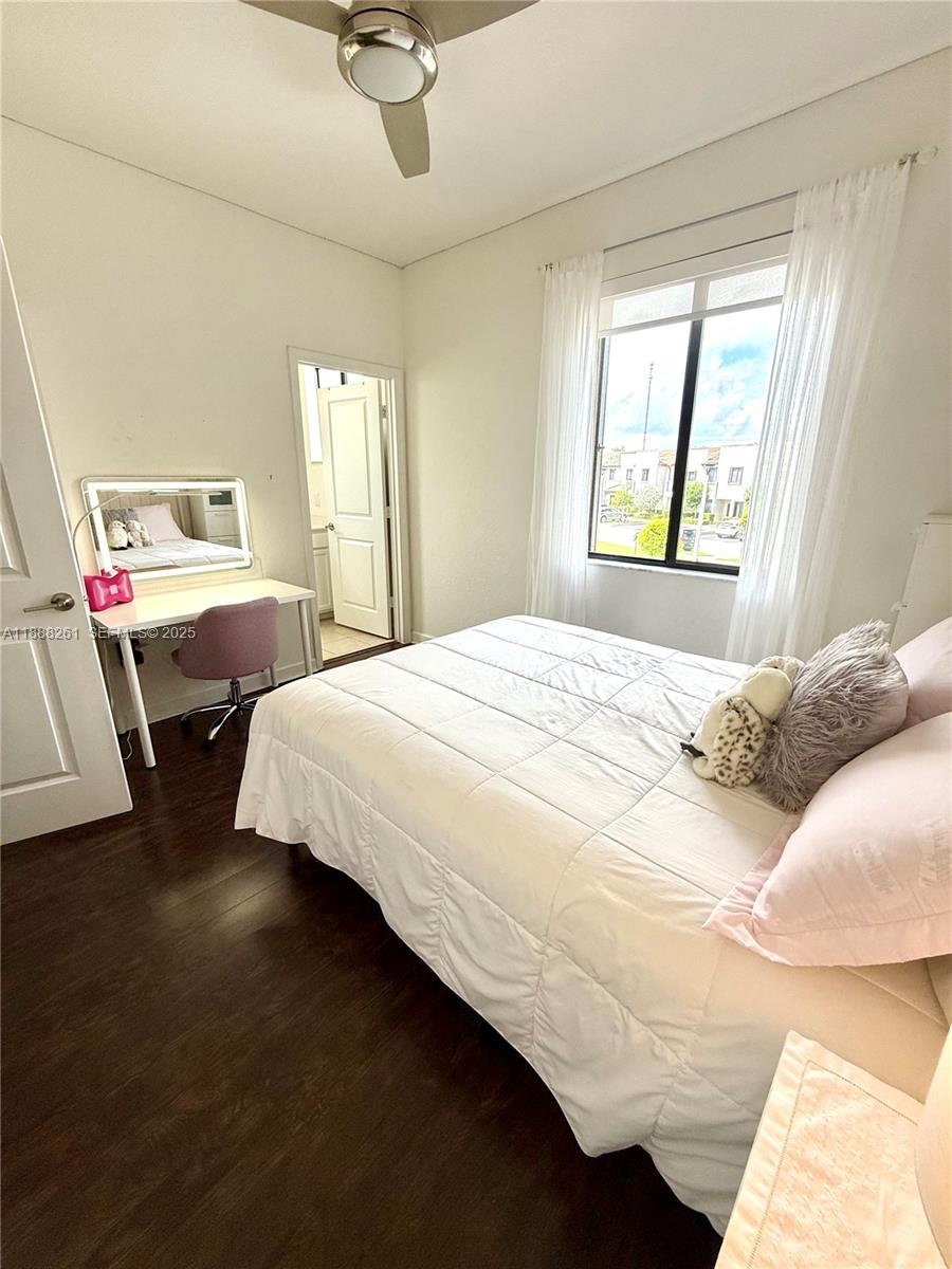 400 Northeast 208th Terrace, Unit 400 Miami, FL 33179 - Photo 32 of 53 a bedroom with a bed and window